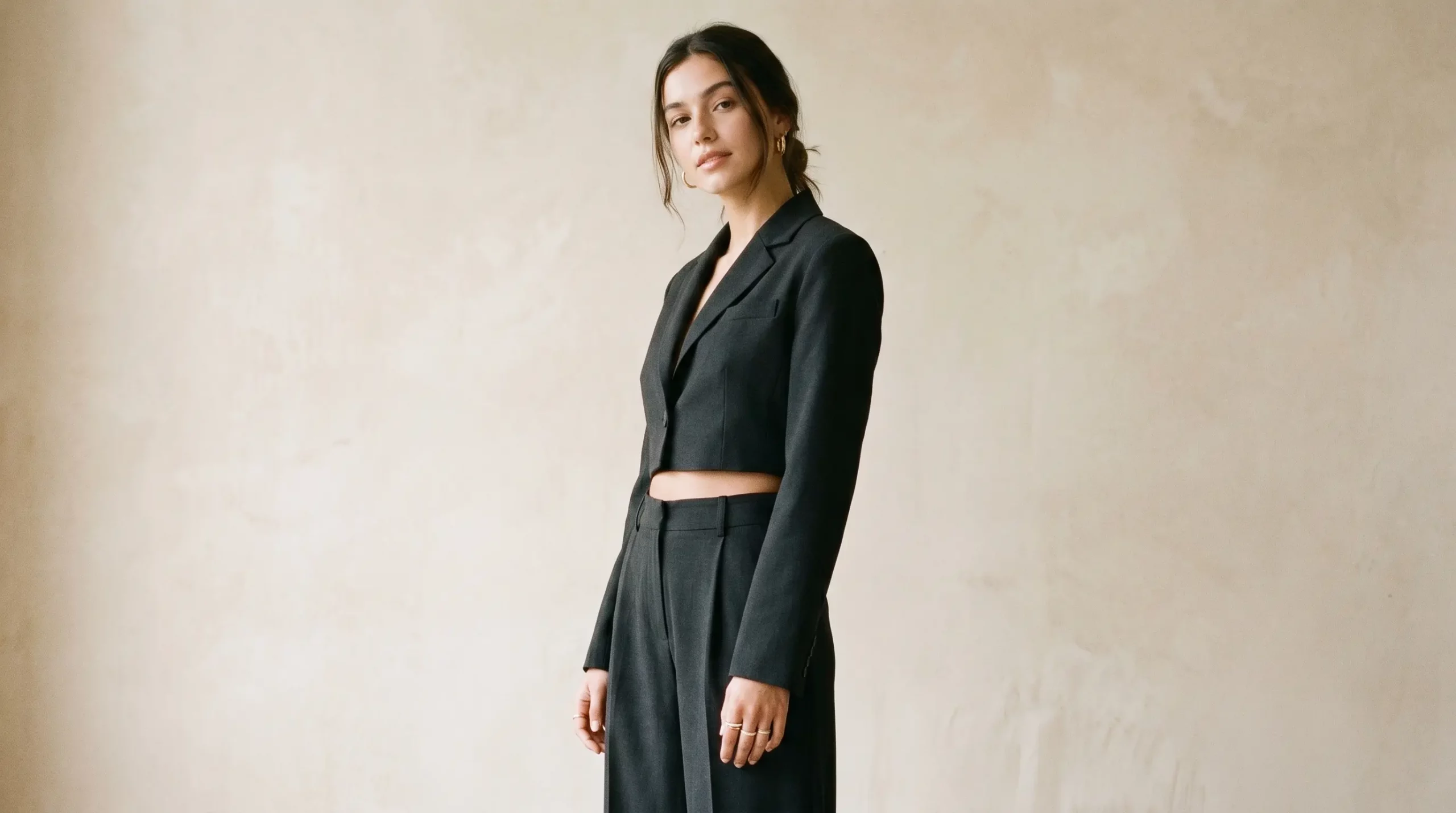 fashion editorial photo, young woman 20s, wearing a sleek all black minimalist outfit fashion editorial photo, young woman 20s, wearing a sleek all black minimalist outfit